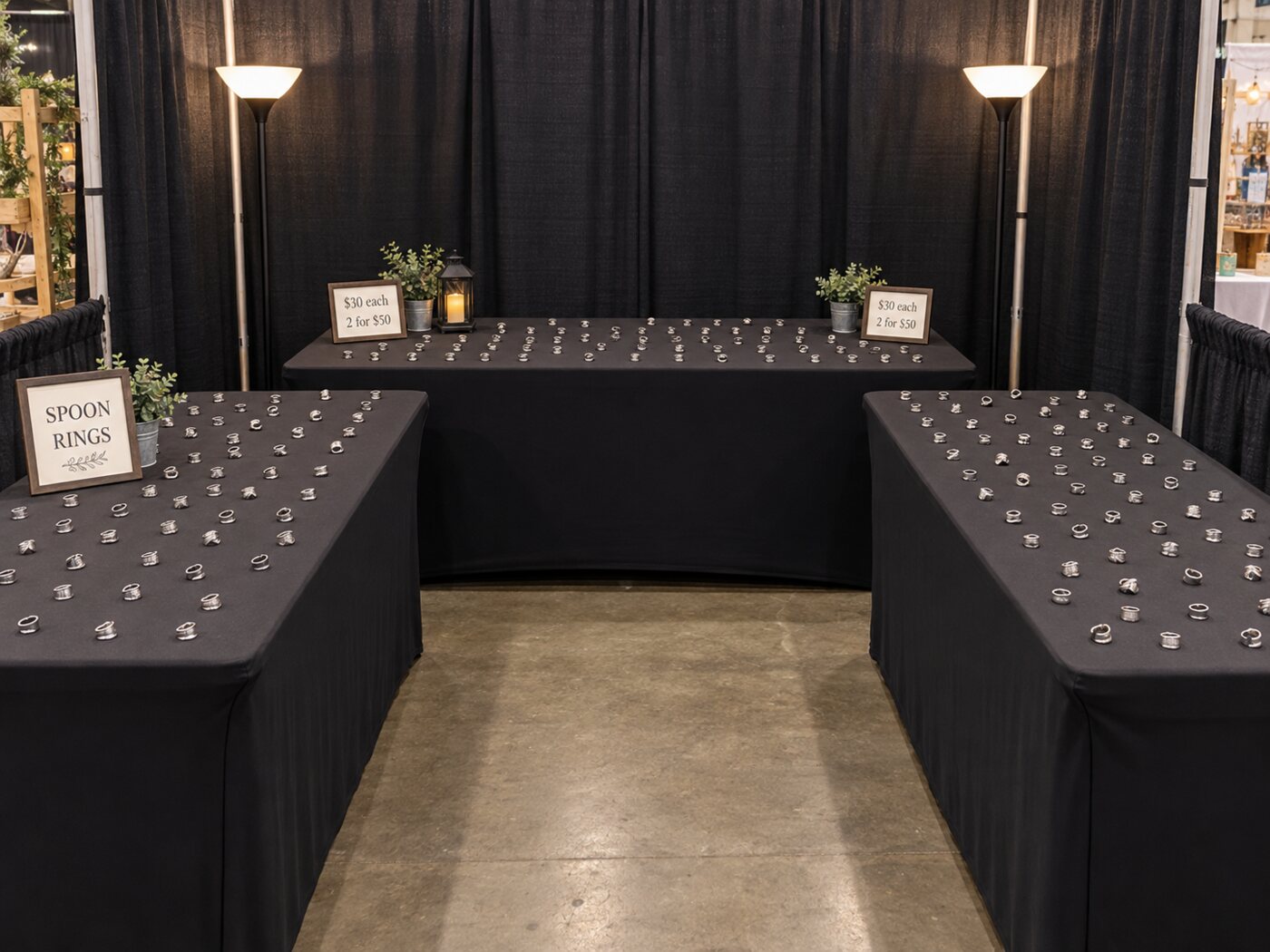 Silver Bent ring display at an in-person market